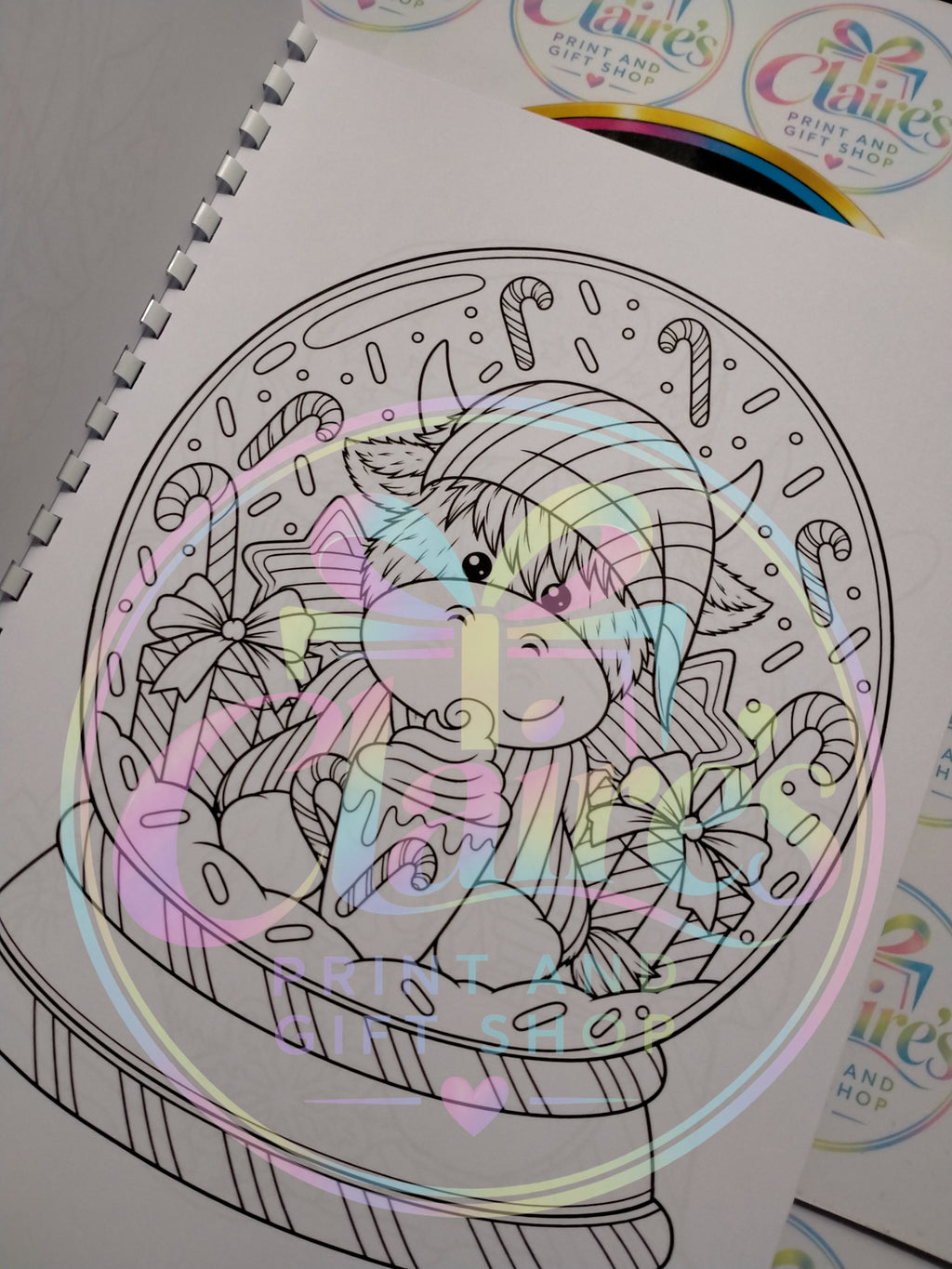 Highland cow Christmas snow globe colouring page