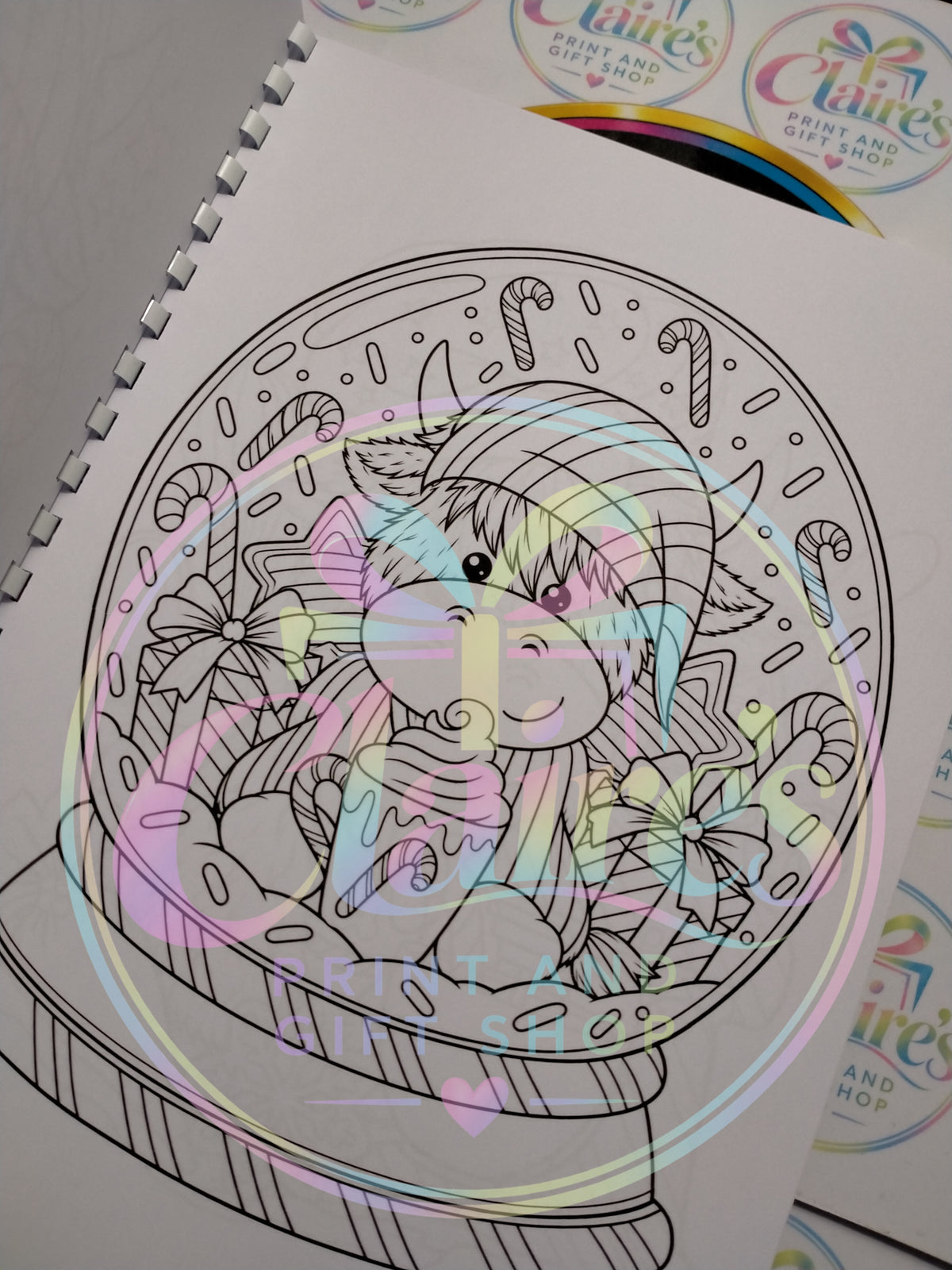 Highland cow Christmas snow globe colouring page