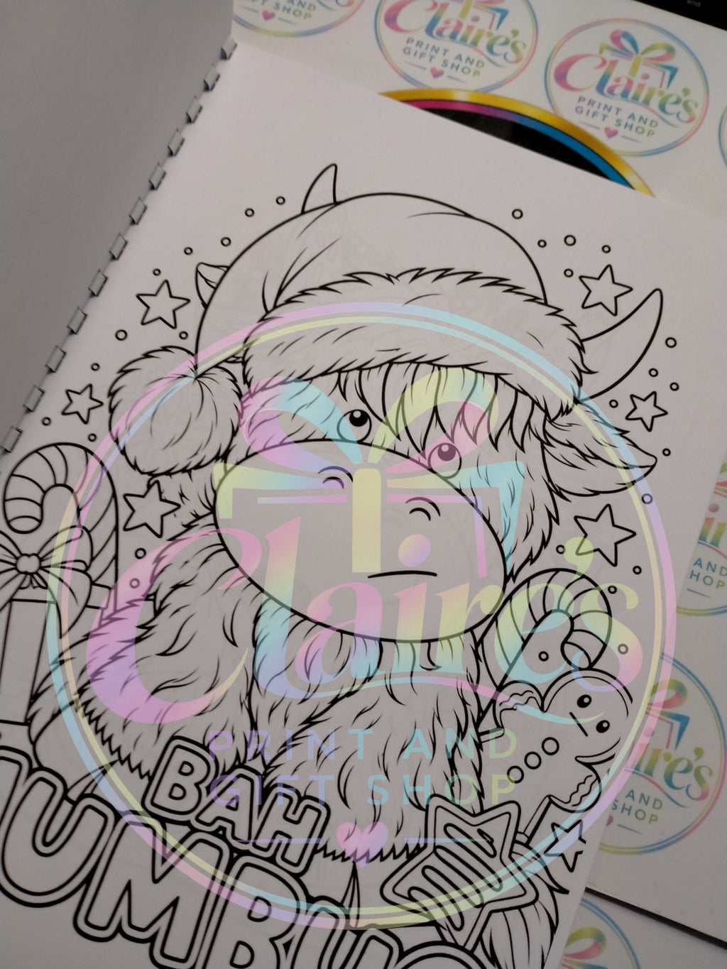 Highland cow in a Santa hat colouring page