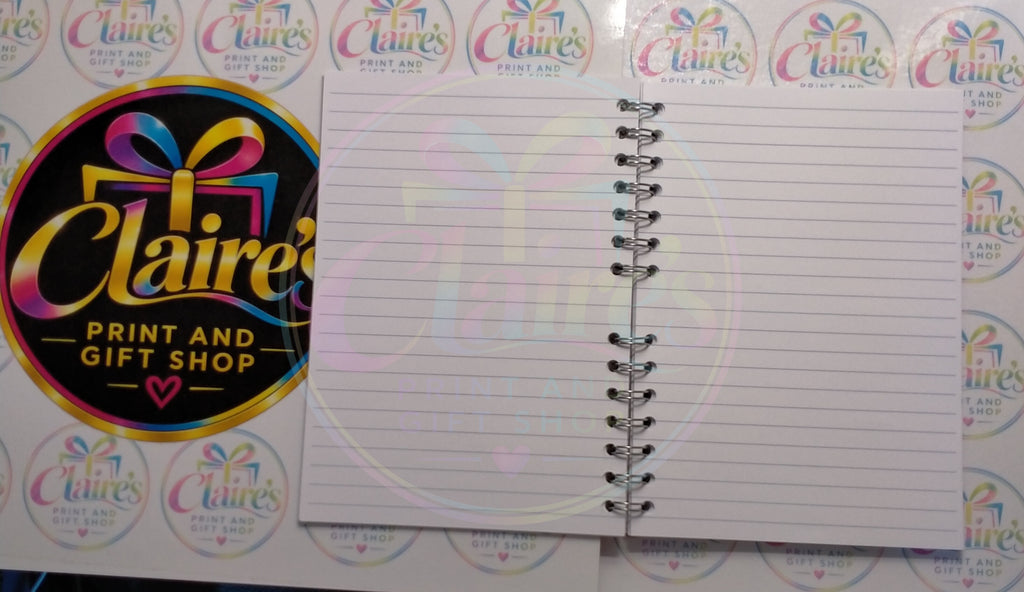 Open notebook showing lined pages and wire binding
